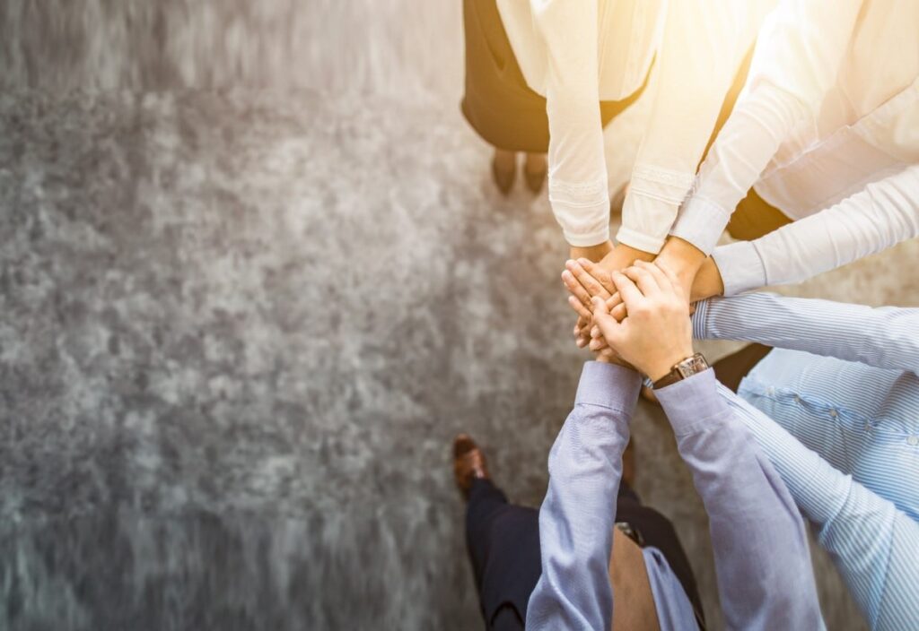 Aufgabenmanagement; Hände Zusammenhalt